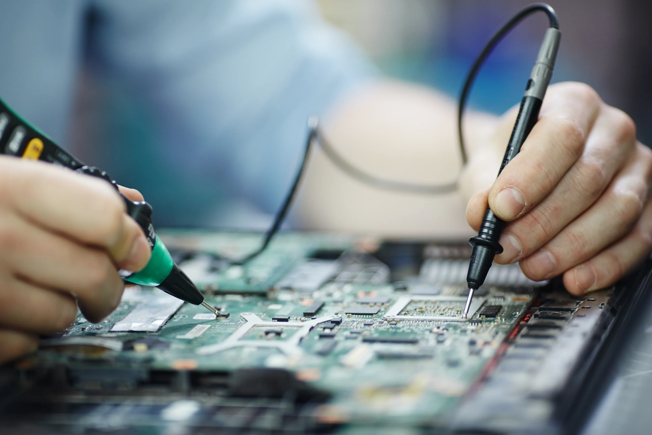 MCS Computer certified technician repairing laptop circuit board in Madurai
